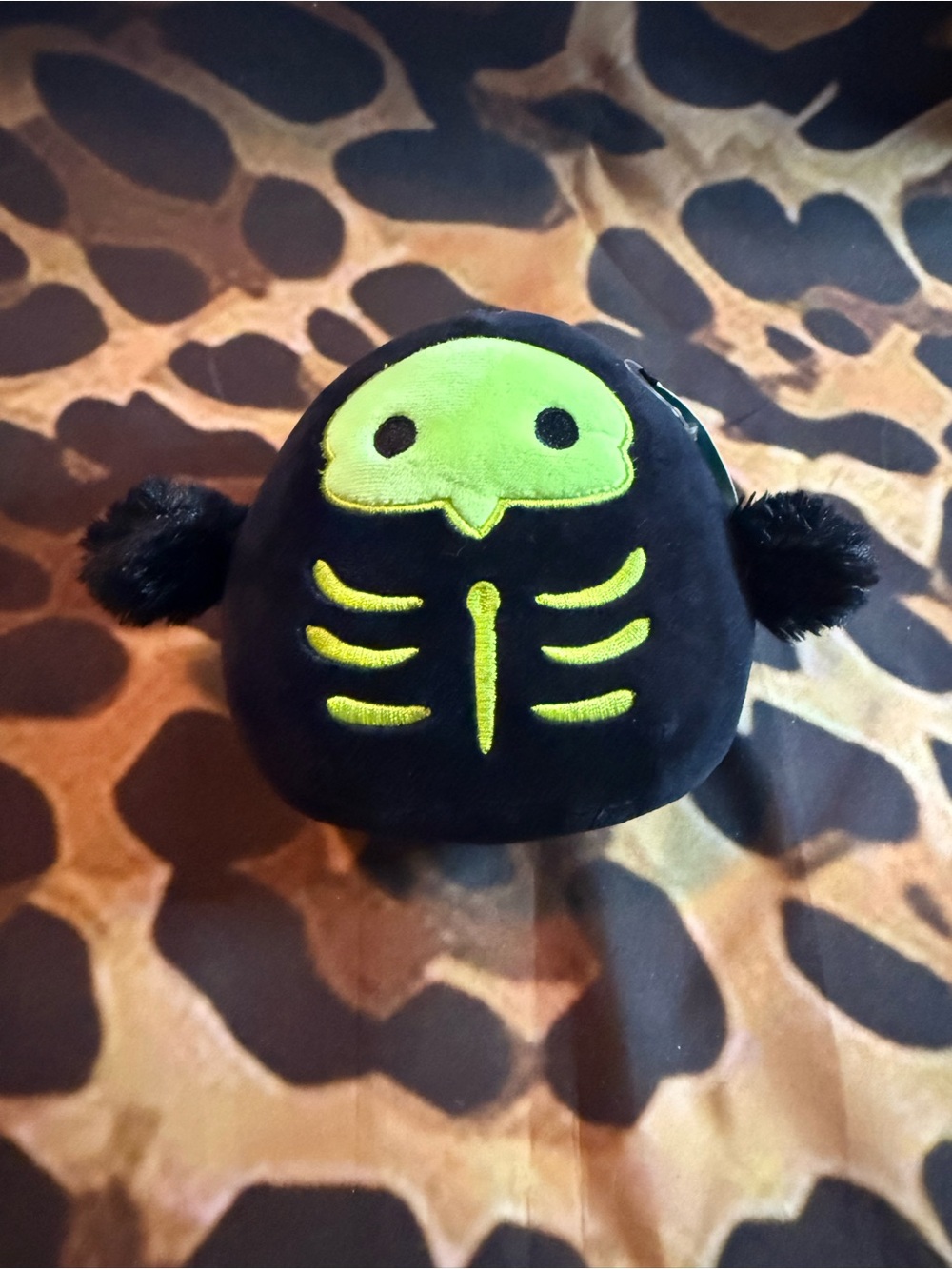 Serge Squishmallow Black Plush with Neon Green Skeleton Bird